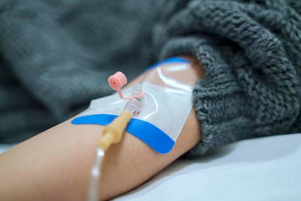 istock Woman having an iv drip at hospital 1191540887