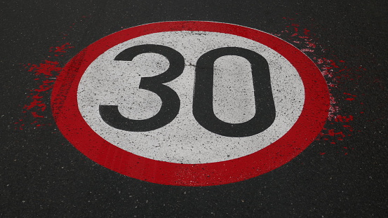 Maximum speed painted on the road surface. Maximum speed 30 km per hour.