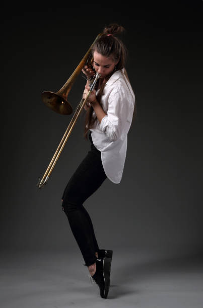 istock Girl dancing with trombone 1191542191