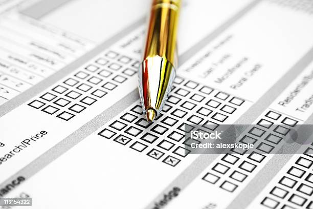 Closeup Of Gold Pen On Top Of A Survey Sheet Stock Photo - Download Image Now - Application Form, Grading, Advice