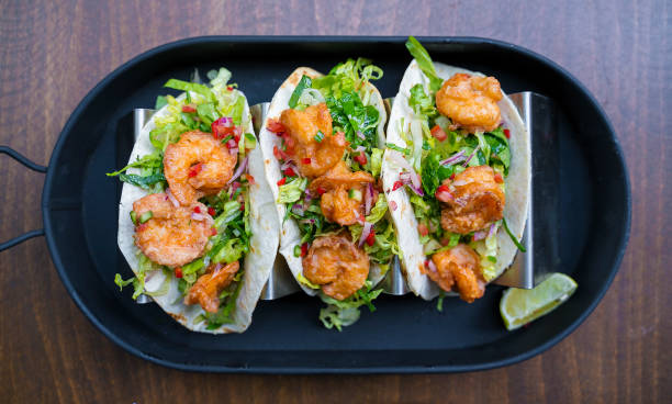 istock Spicy Shrimp Tacos with Avocado Salsa - directly above 1191545747