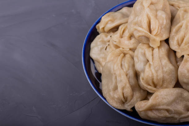 istock Delicious mantas on a plate on gray background 1191548128