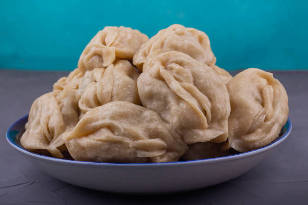 istock Delicious mantas on a plate on gray background 1191548140