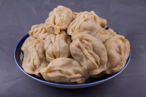 istock Delicious mantas on a plate on gray background 1191548147