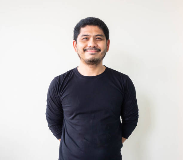 istock Asian man stand and smile with black shirt. 1191556651