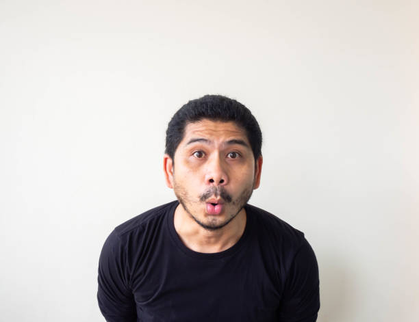 istock Troubled young asian guy trying think up plan or idea, pensive expression. Smiling with thoughtful face. Doubt concept. 1191556653
