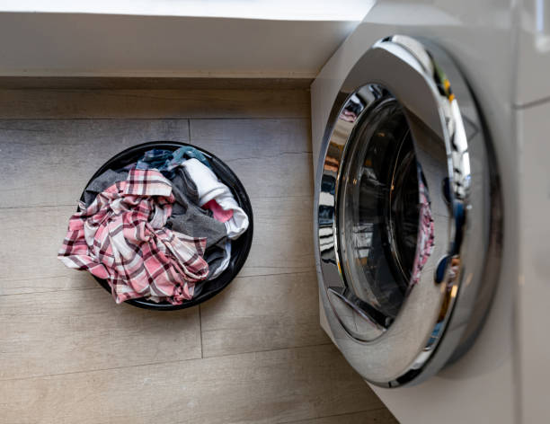 istock Laundry basket next to the washing machine 1191558937