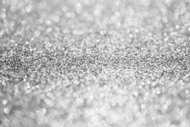 istock Abstract blur silver glitter sparkle defocused bokeh light background 1191565982