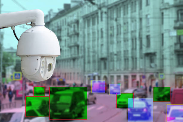 istock The concept of video surveillance and security technologies. Video surveillance camera on the background of the city road with cars. Definition zone at the cars 1191566002