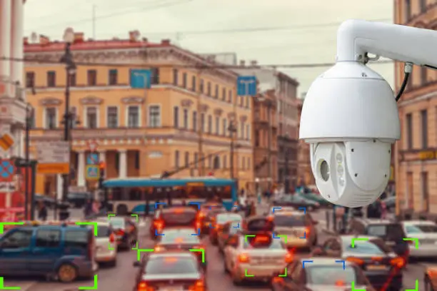 The concept of video surveillance and security technology. The surveillance camera tracks violators of traffic rules during traffic congestion. Cars at definition zone.