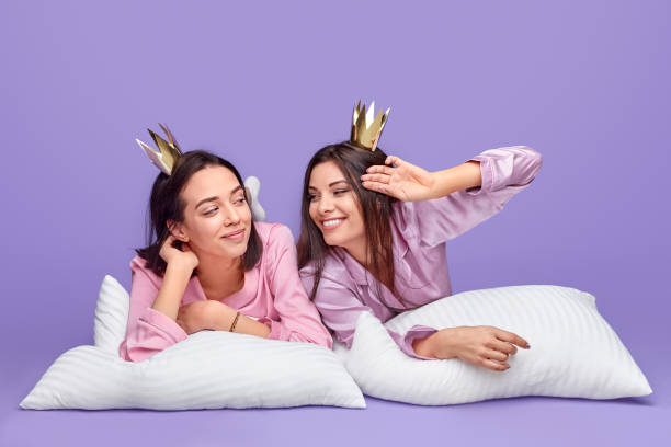 istock Narcissistic fellows in nightwear resting on pillows 1191566314