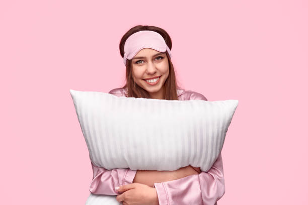 istock Cheerful female hugging pillow 1191566360