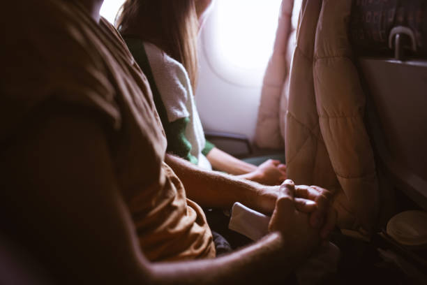 istock Passengers sitting in the airplane 1191566490