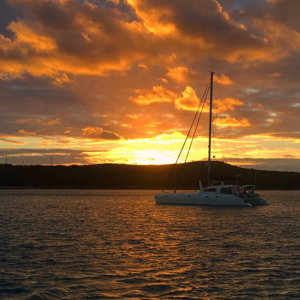 istock Catamaran Sunset at Anchor 1191569245