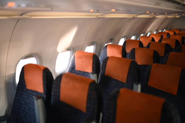 istock Interior of airplane with empty cabin 1191569391