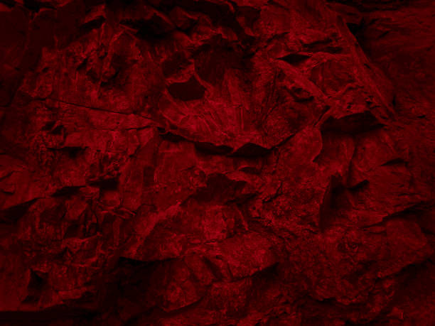 Toned rock background. Dark red stone texture for your design.