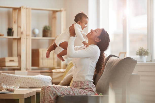 istock Joyful Mother Playing with Baby 1191574618