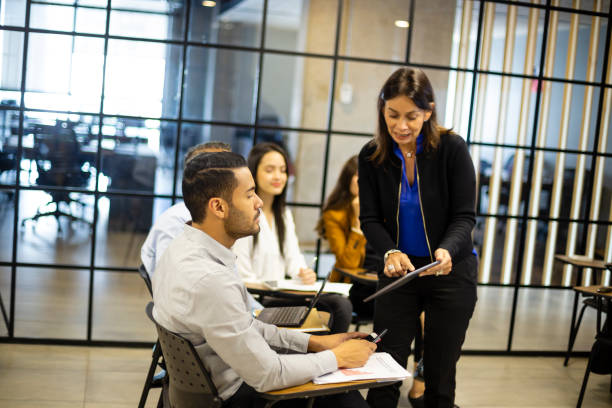 istock Group of people talking about some kind of work at the office 1191579961