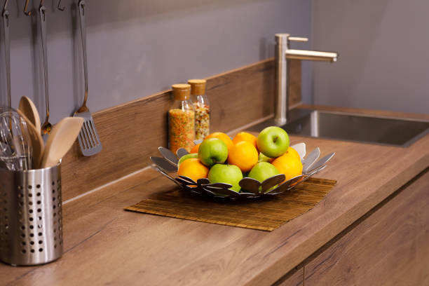 istock apples and oranges on the wooden kitchen counter 1191581020