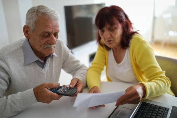 istock Senior couple paying bills at home 1191582924
