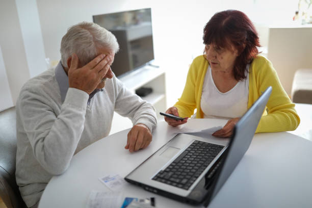 istock Senior couple paying bills at home 1191583678