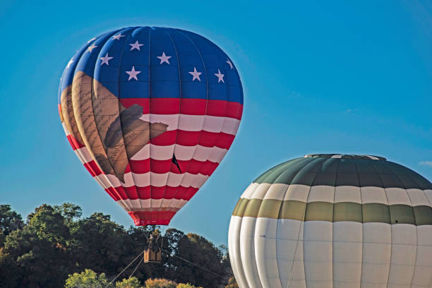 istock Hot air balloons beneath a clear blue sky. 1191583921