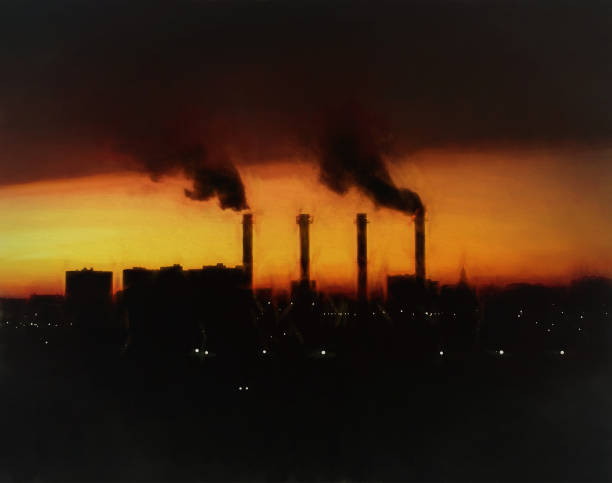 istock Dramatic industrial chimneys during sunset illustration 1191586410