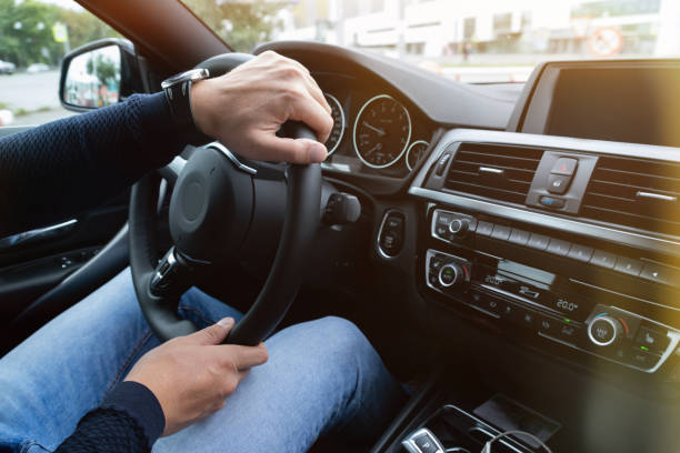 istock Man driving a business class car 1191590238