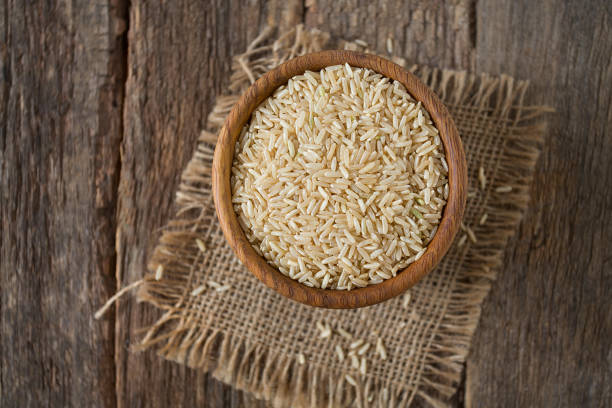 istock Brown rice in a bowl on wooden 1191597659