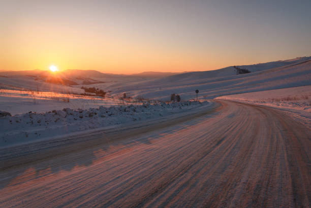 istock road snow mountains winter pass sunset sun 1191599361