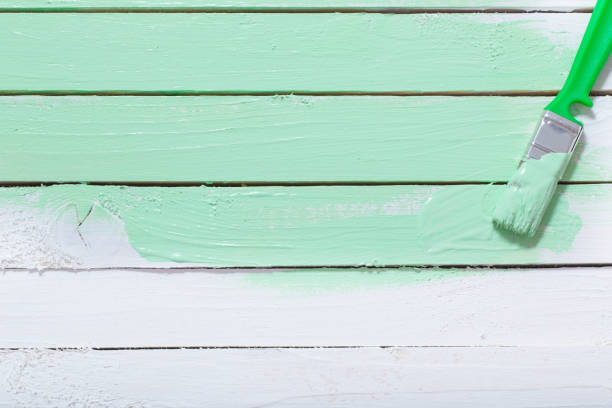 istock white and green painted wooden background 1191600326