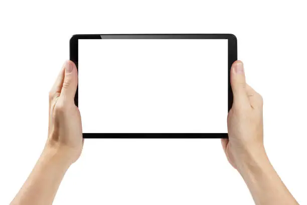 Photo of Hands holding black tablet on white