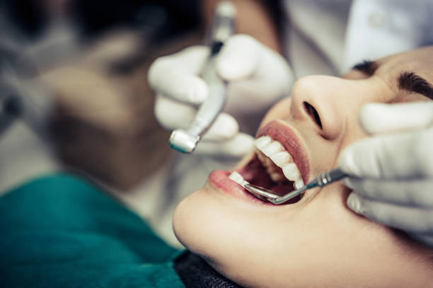 istock The dentist examines the patient's teeth. 1191603089