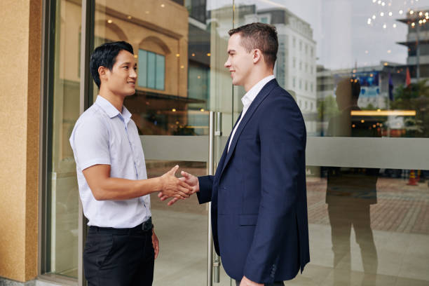 istock Business people shaking hands 1191604542