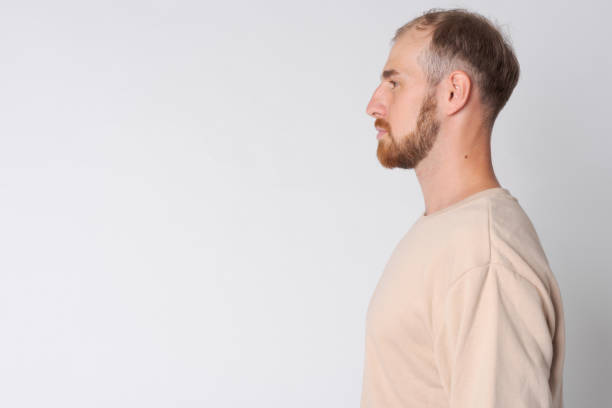 istock Closeup profile view of young bearded man 1191605846