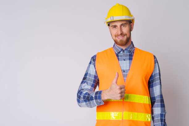 istock Happy young bearded man construction worker giving thumbs up 1191605876
