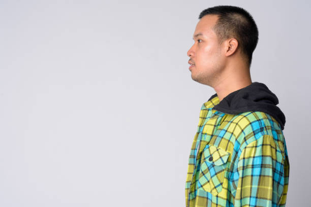 istock Profile view of young Asian hipster man 1191606878