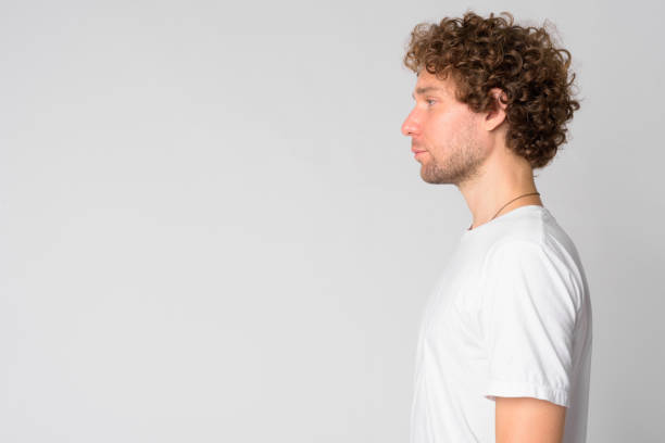 istock Profile view of handsome man with curly hair 1191607584