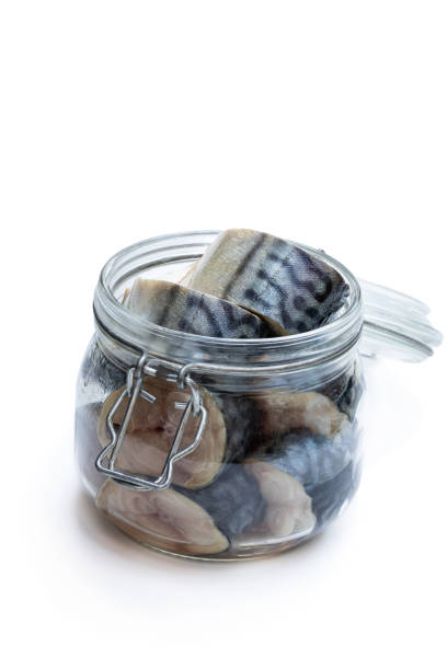 istock Mackerel slices in glass jar isolated on white. 1191610806