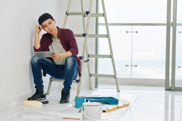 istock Pensive man in room under maintenance 1191610994