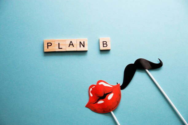 istock Saint Valentine, love, flatlay overhead top plan b, backup plan props emotion lips and mustache blue background copy space 1191612995