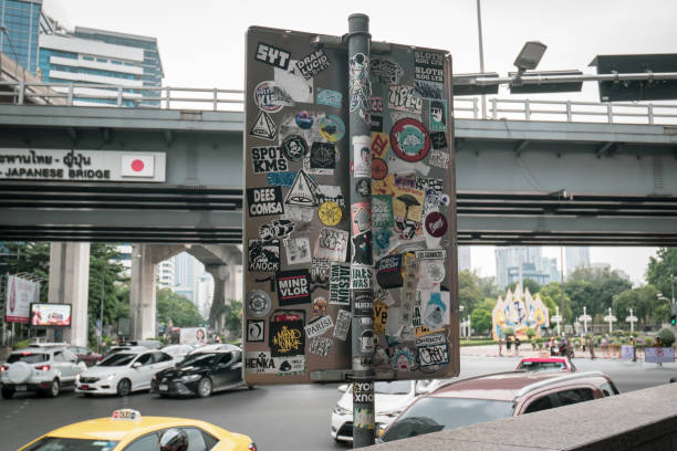 Bangkok, Thailand - November 2, 2019 : Sticker art or sticker bombing on the road sign.