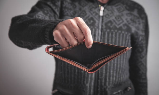 istock Man holding empty wallet. No money 1191615985