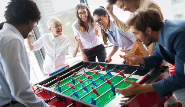 istock Excited diverse employees enjoying funny activity at work break, creative friendly workers play game 1191616231