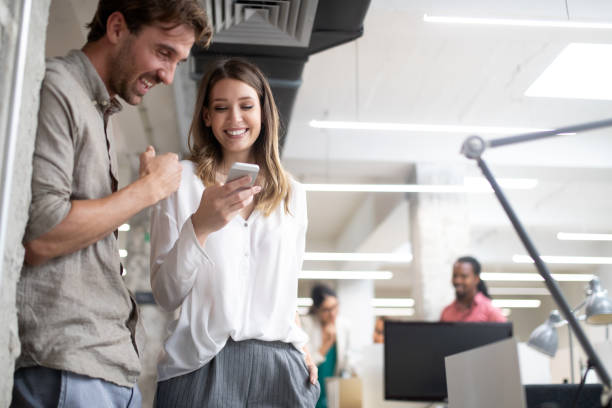 istock Business people having fun and chatting at workplace office 1191617993