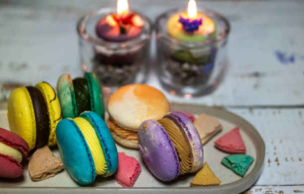 istock pastel-colored delicious macaroons and candles 1191618550