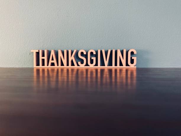 Word THANKSGIVING on blue background