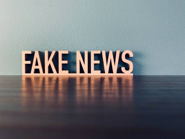 istock Words FAKE NEWS on blue background 1191620686