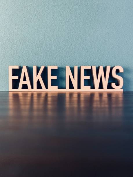 istock Words FAKE NEWS on blue background 1191620722