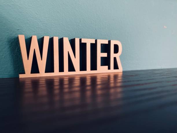 istock Word WINTER on blue background 1191621201